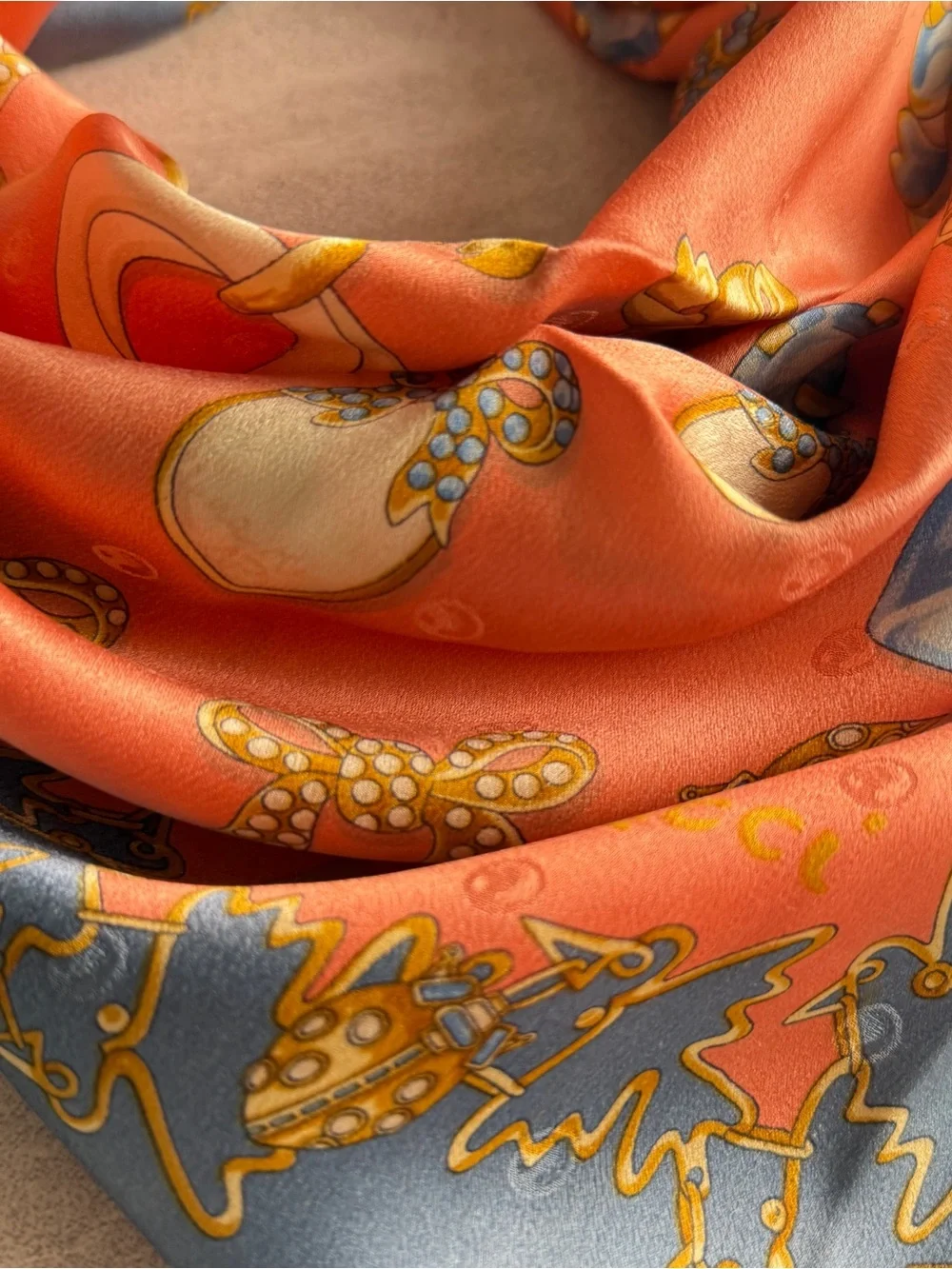 Nina Ricci Coral Scarf with Blue and Gold Jewelry Motifs